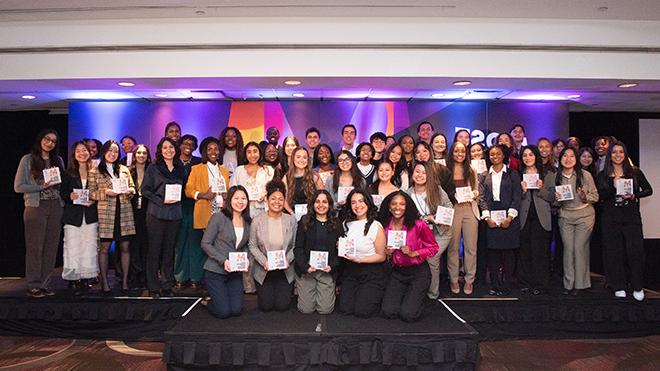 A photo of 50 college students posing at the AAF program