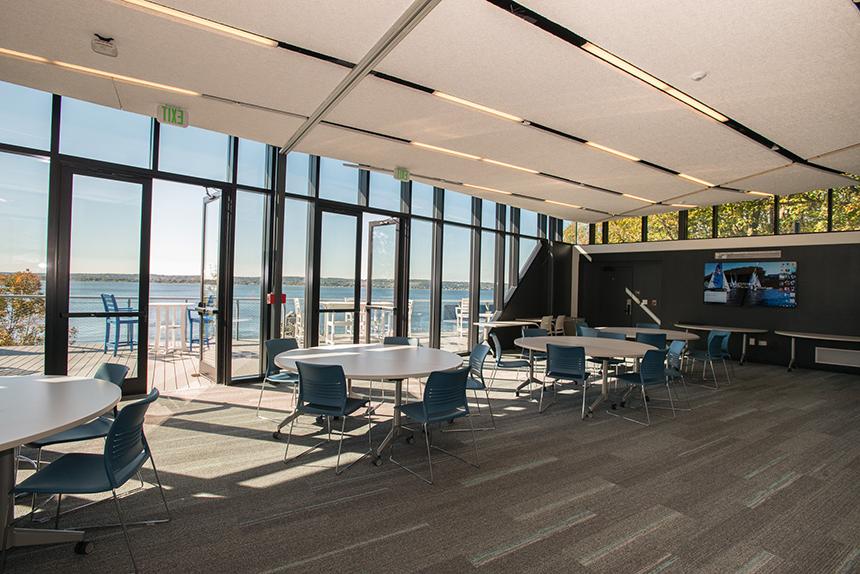 Conference room with a wall of floor-to-ceiling windows with bay views