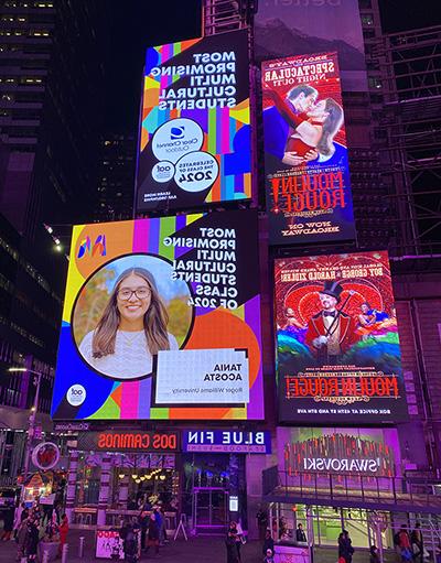 A billboard in Times Square featuring a photo of Tania Acosta